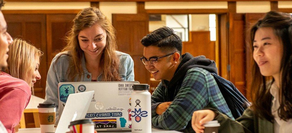 five students smiling inside